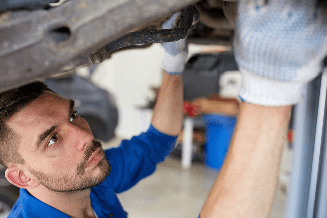 Mechanic checking underneath a vehicle - Vehicle Repairs Bathgate, West Lothian