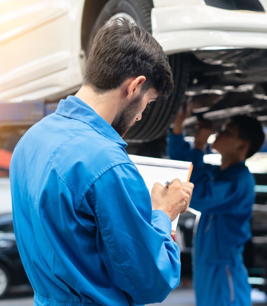Two mechanics ticking off a service checklist - Car Servicing Bathgate, West Lothian